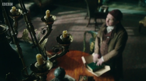 Mr. Norrell casting his spell to destroy Jonathan Strange's book.
